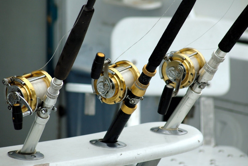 black and golden fishing reel