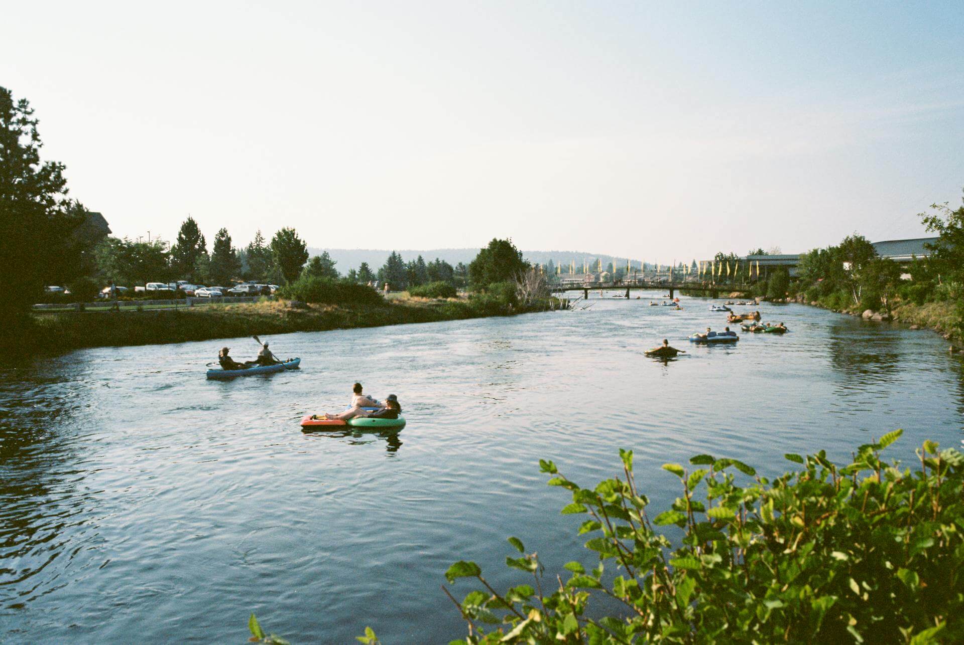 Kayaker paddling on calm water with a simple day trip setup